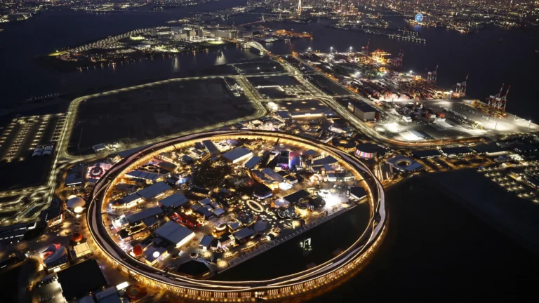 Grand Ring glowing over Expo 2025 Osaka at dusk